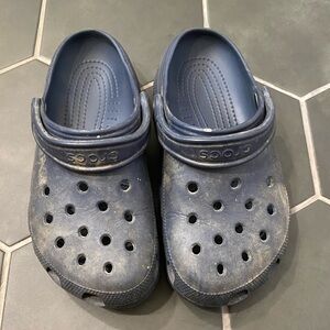 Worn navy blue crocs. M4 W6